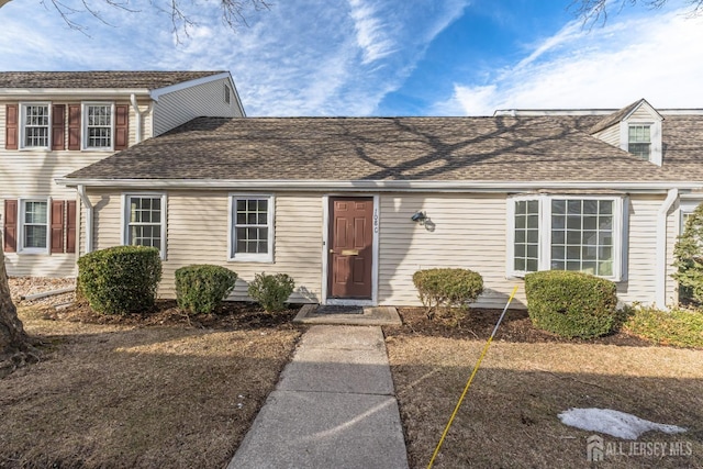 view of front of home featuring roof with shingles