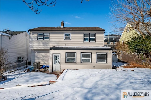 40 Brown Ave, Iselin, NJ 08830 - snow covered back of property with a chimney