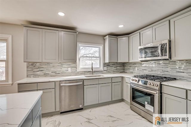 40 Brown Ave, Iselin, NJ 08830 - kitchen with appliances with stainless steel finishes, gray cabinets, light marble finish floors, recessed lighting, and light stone countertops