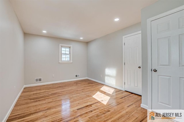 40 Brown Ave, Iselin, NJ 08830 - unfurnished bedroom featuring light wood-style flooring and recessed lighting