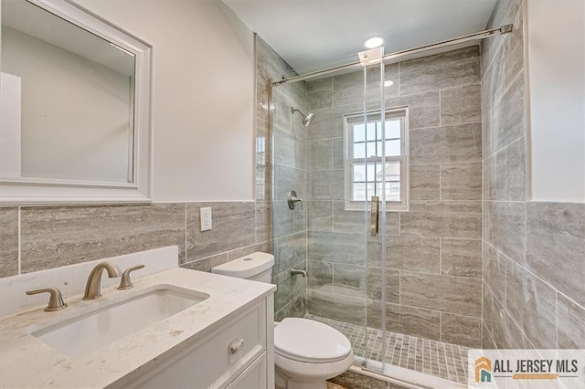 40 Brown Ave, Iselin, NJ 08830 - bathroom with tile walls, a stall shower, and vanity