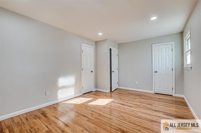 40 Brown Ave, Iselin, NJ 08830 - unfurnished bedroom featuring light wood-type flooring and recessed lighting