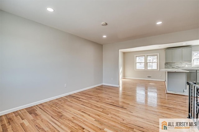 40 Brown Ave, Iselin, NJ 08830 - unfurnished living room featuring light wood-type flooring and recessed lighting