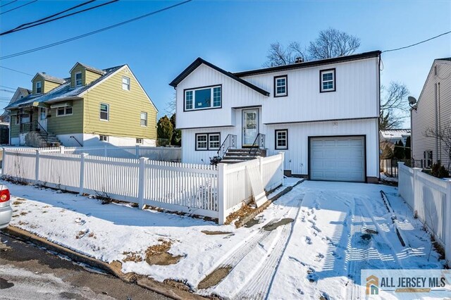 view of front of home with a garage