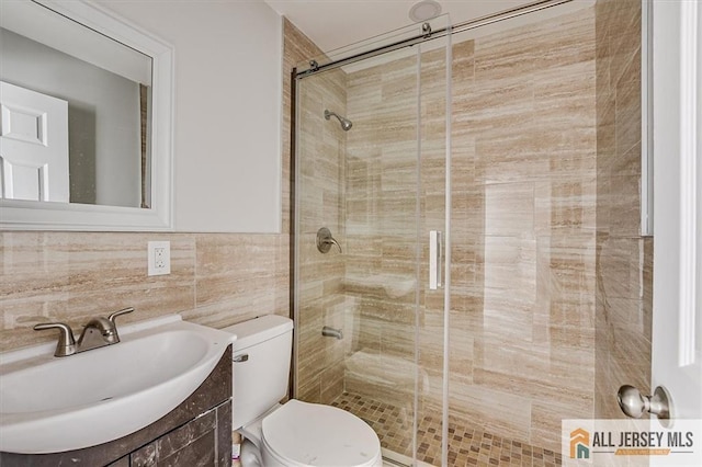 40 Brown Ave, Iselin, NJ 08830 - full bath featuring a stall shower, vanity, and tile walls