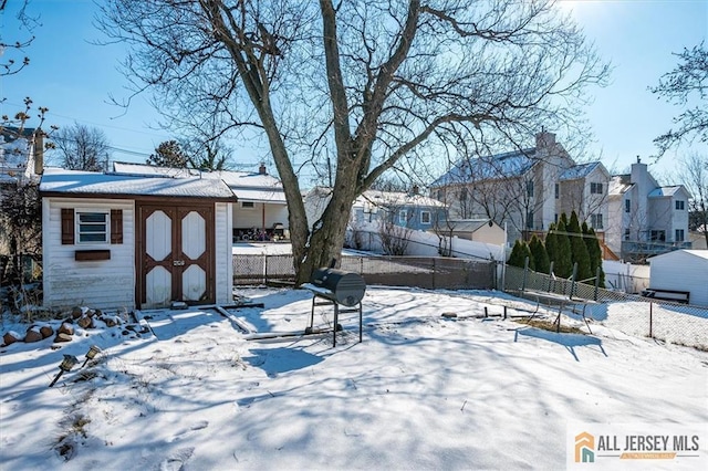 40 Brown Ave, Iselin, NJ 08830 - yard layered in snow featuring a shed and a residential view