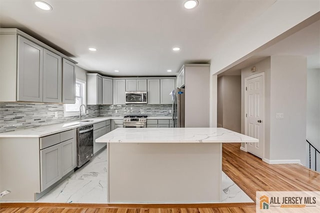 40 Brown Ave, Iselin, NJ 08830 - kitchen with stainless steel appliances, gray cabinetry, light marble finish floors, decorative backsplash, and recessed lighting