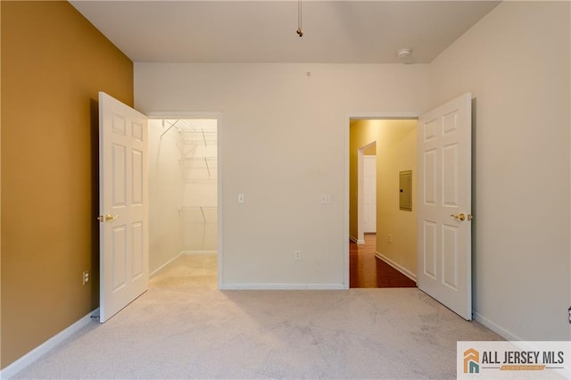 1410 Colts Cir, Lawrence, NJ 08648 - unfurnished bedroom featuring carpet floors, a walk in closet, a closet, and electric panel