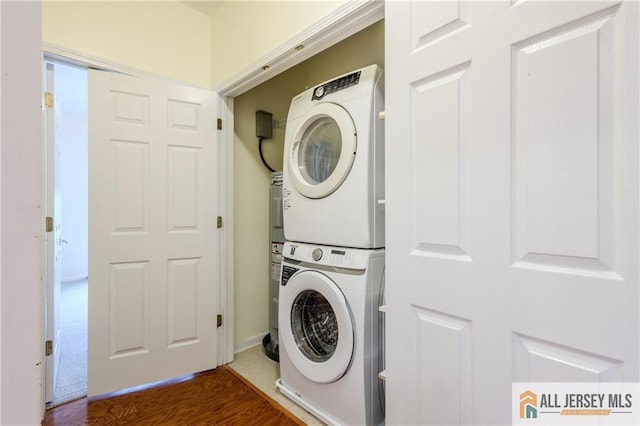 1410 Colts Cir, Lawrence, NJ 08648 - laundry area featuring stacked washer and clothes dryer and wood finished floors