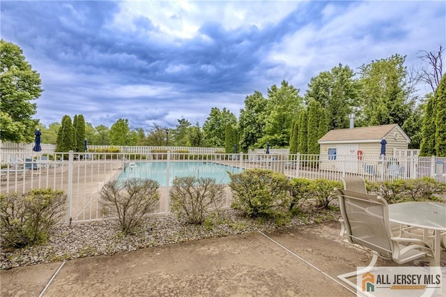 1410 Colts Cir, Lawrence, NJ 08648 - community pool featuring a patio area and view of wooded area
