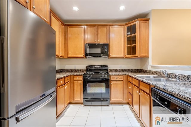 1410 Colts Cir, Lawrence, NJ 08648 - kitchen with black appliances, recessed lighting, light tile patterned floors, glass insert cabinets, and dark stone counters