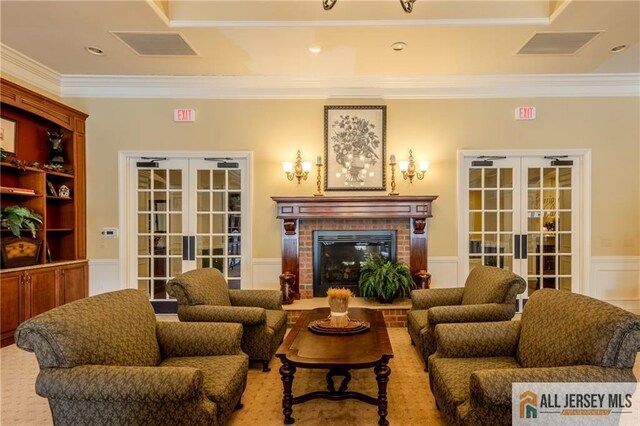 1410 Colts Cir, Lawrence, NJ 08648 - living area with french doors, ornamental molding, a wainscoted wall, a decorative wall, and a brick fireplace