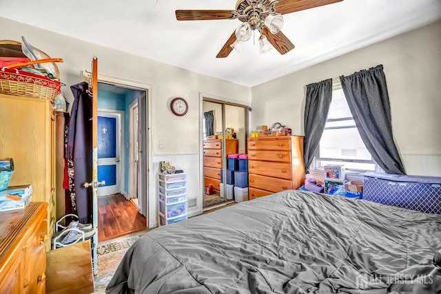 29 Pulawski Ave, South River, NJ 08882 - bedroom featuring a closet, wainscoting, wood finished floors, and ceiling fan