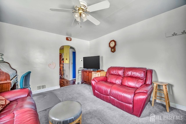 29 Pulawski Ave, South River, NJ 08882 - living room with arched walkways, ceiling fan, and carpet