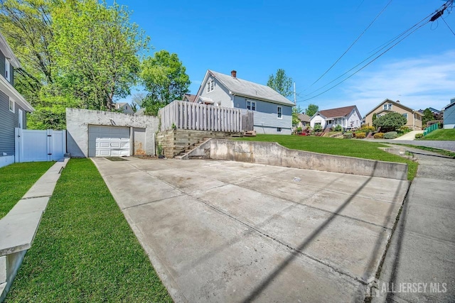 29 Pulawski Ave, South River, NJ 08882 - bungalow-style house with a gate, driveway, a garage, and a residential view