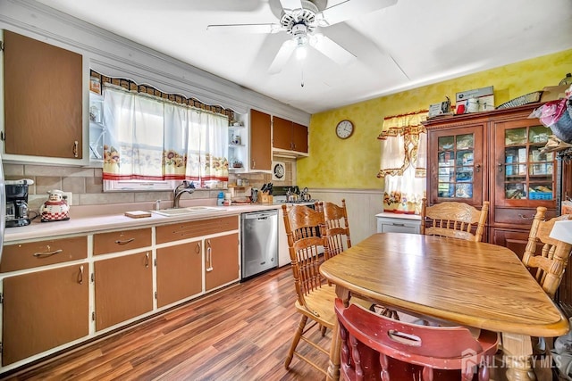 29 Pulawski Ave, South River, NJ 08882 - kitchen featuring stainless steel dishwasher, wood finished floors, light countertops, a wainscoted wall, and ceiling fan