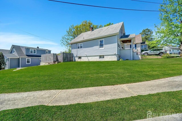 29 Pulawski Ave, South River, NJ 08882 - view of front of house featuring a front lawn and a garage