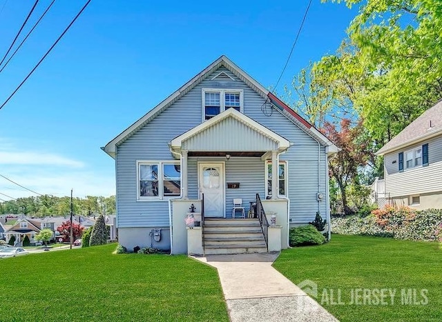 29 Pulawski Ave, South River, NJ 08882 - bungalow-style home featuring covered porch and a front lawn