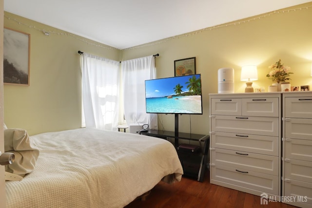 bedroom featuring dark wood-style floors