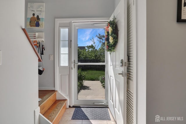 foyer entrance with tile patterned floors