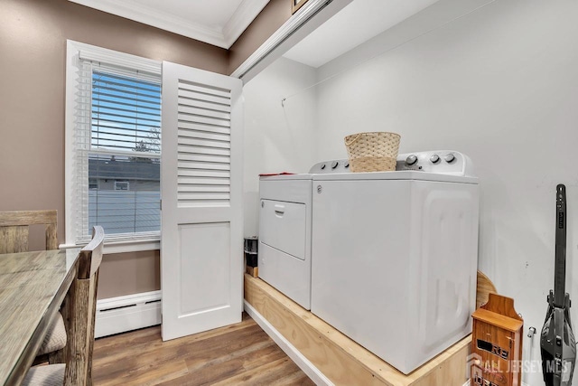 1276 S 11th St S, South Plainfield, NJ 07080 - washroom featuring baseboard heating, washing machine and clothes dryer, ornamental molding, and wood finished floors