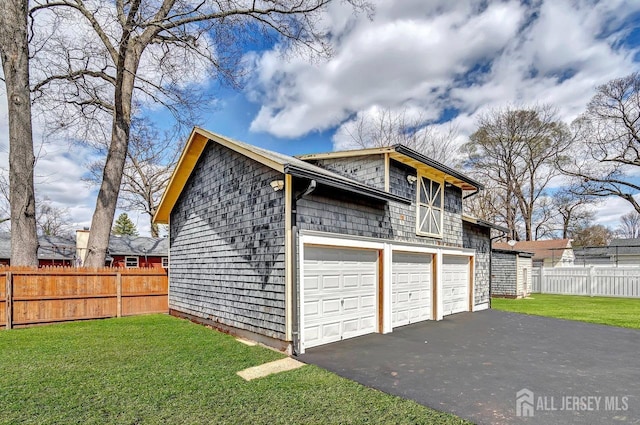 garage featuring driveway