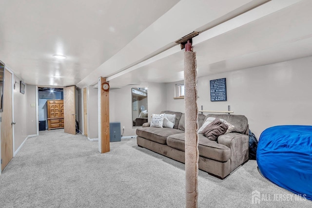 carpeted living room featuring baseboards