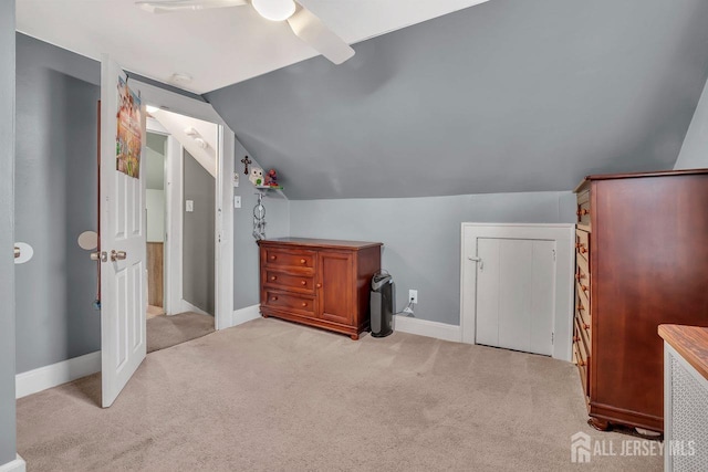 bonus room featuring light carpet, a ceiling fan, lofted ceiling, and baseboards