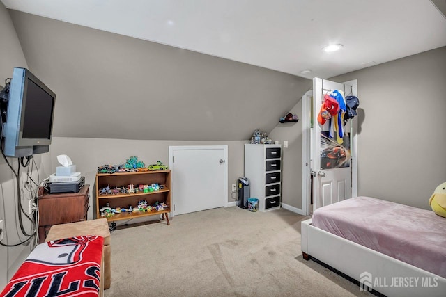 carpeted bedroom featuring lofted ceiling