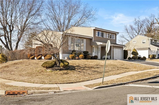 view of front of house with a garage and driveway