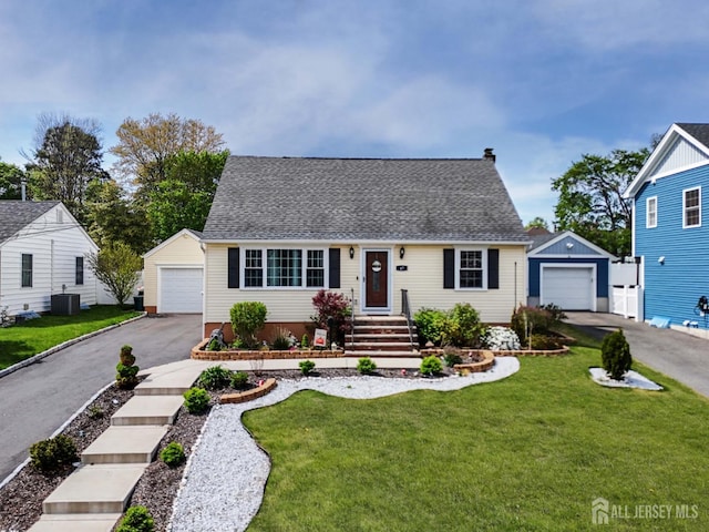 new england style home with an outdoor structure, a garage, and central AC