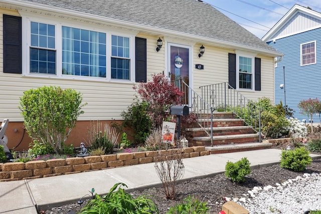 view of front of house with a shingled roof