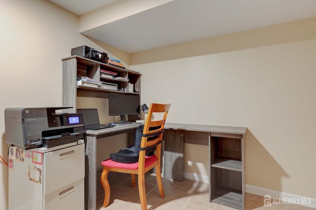 tiled office space featuring baseboards