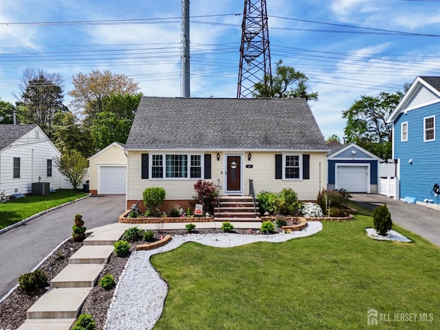 47 Harrison Ave, Milltown, NJ 08850 - cape cod house with a detached garage, an outbuilding, and a shingled roof
