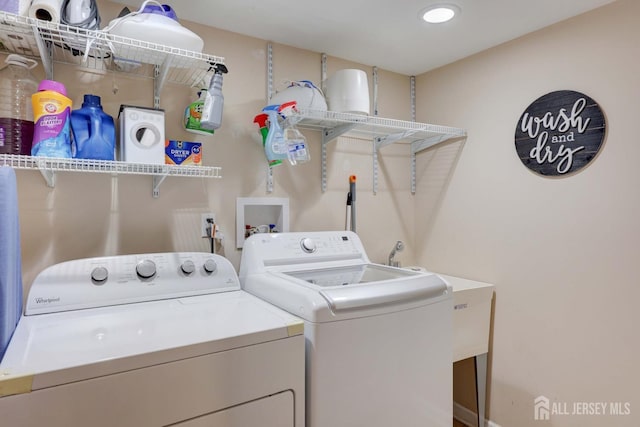 laundry area with laundry area and washer and dryer