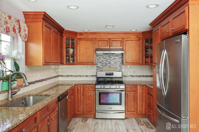 47 Harrison Ave, Milltown, NJ 08850 - kitchen featuring appliances with stainless steel finishes, a sink, under cabinet range hood, tasteful backsplash, and recessed lighting