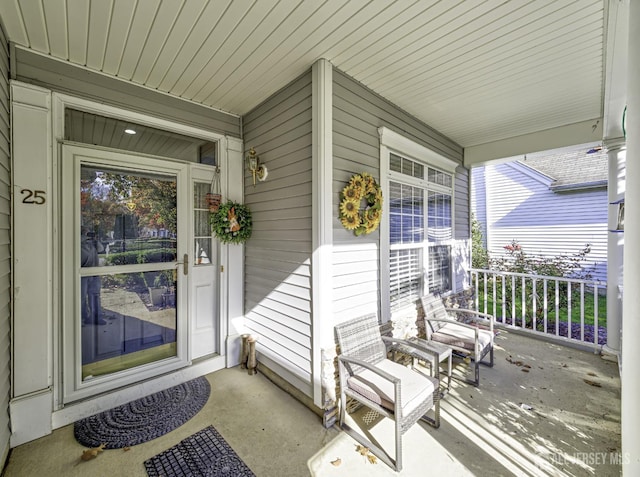 entrance to property with covered porch