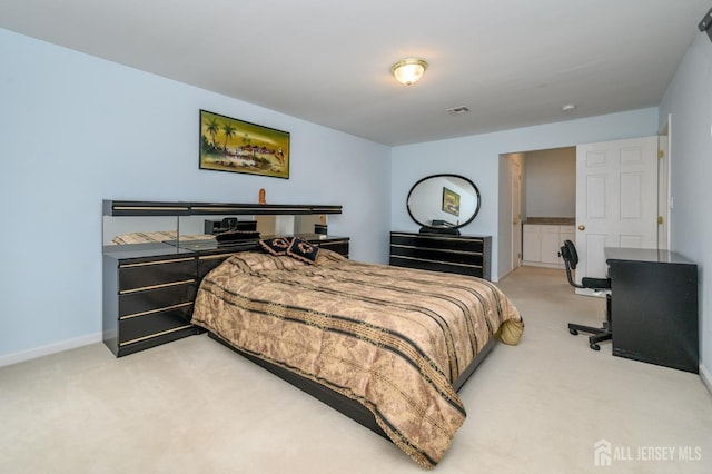 bedroom featuring carpet and baseboards