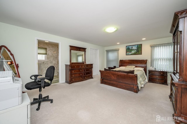bedroom with washer and clothes dryer, light colored carpet, and recessed lighting
