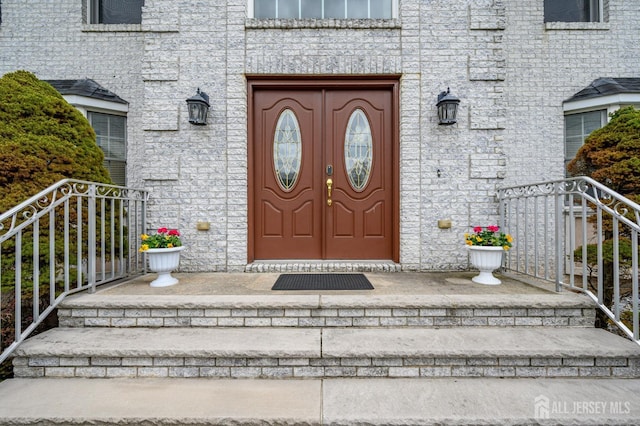 doorway to property with stone siding