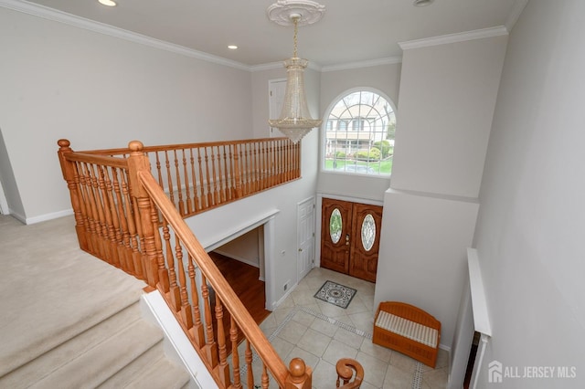 foyer with recessed lighting, tile patterned flooring, baseboards, and ornamental molding