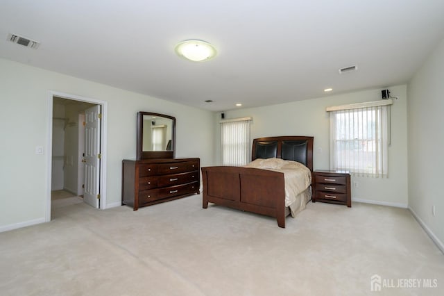 bedroom featuring light carpet, baseboards, and recessed lighting