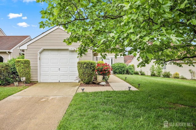 639 Madison Dr Unit C, Monroe, NJ 08831 - view of property hidden behind natural elements with driveway and a front lawn