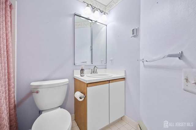 639 Madison Dr Unit C, Monroe, NJ 08831 - bathroom featuring vanity, toilet, tile patterned flooring, curtained shower, and baseboards
