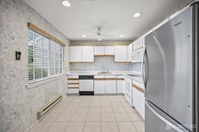639 Madison Dr Unit C, Monroe, NJ 08831 - kitchen featuring white appliances, a baseboard radiator, light countertops, white cabinets, and recessed lighting