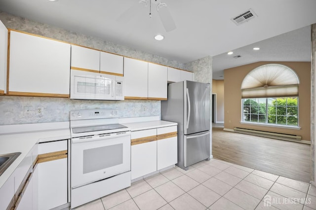 639 Madison Dr Unit C, Monroe, NJ 08831 - kitchen featuring white appliances, a baseboard radiator, light countertops, white cabinets, and recessed lighting