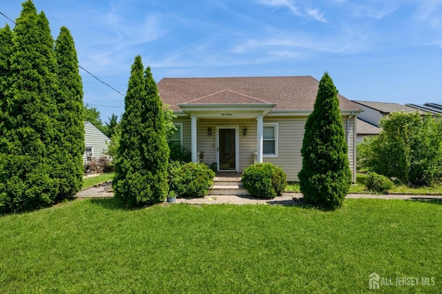 17 New Brunswick Ave, Matawan, NJ 07747 - view of front facade featuring a front lawn and roof with shingles