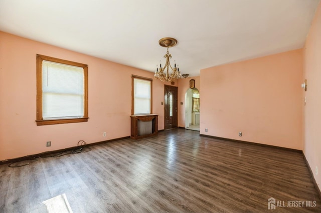 17 New Brunswick Ave, Matawan, NJ 07747 - unfurnished room featuring a chandelier, wood finished floors, and arched walkways