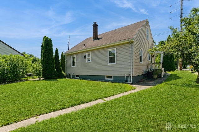 17 New Brunswick Ave, Matawan, NJ 07747 - rear view of house with a yard and a chimney