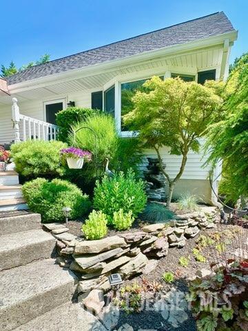 383 S Stump Tavern Rd S, Jackson, NJ 08527 - view of side of home featuring roof with shingles